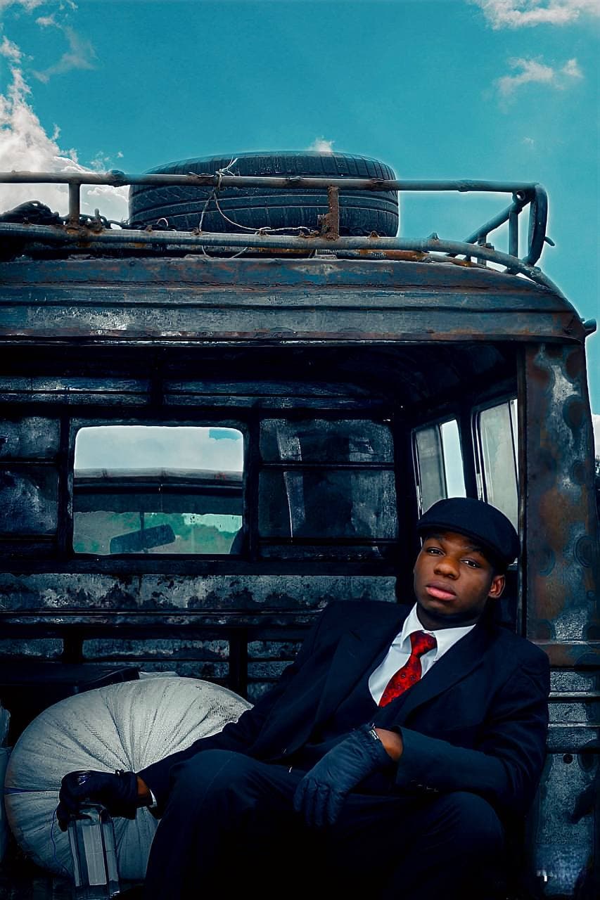 Miracle LRE seated in the back of a vintage truck